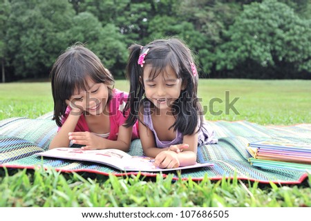 Young and cute best friends studying and do revision together.