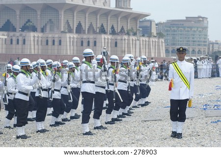 Navy soldier performing gun parade marching