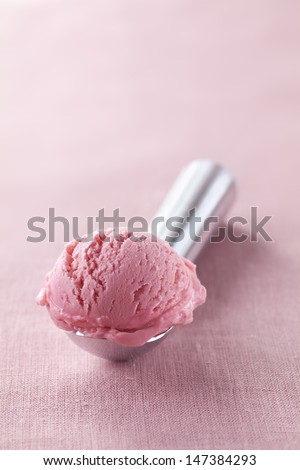 Scoop of strawberry natural ice cream close up