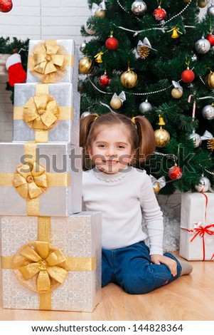 Portrait of the girl with the packaged gift