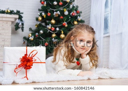 Little girl with the packaged gift