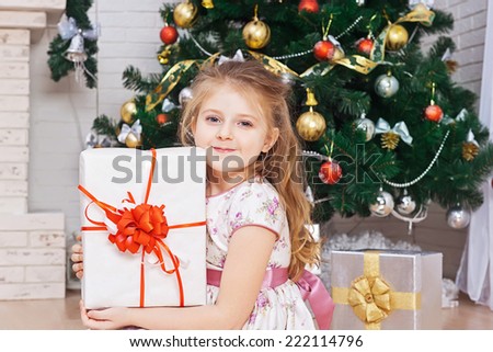 Little girl with the packaged gift