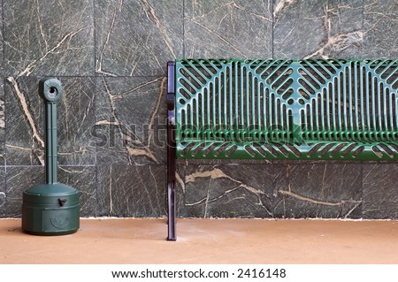 smoking area outside modern office building a metal bench with a large ash tray