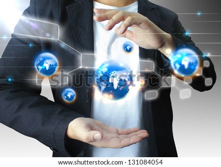 businessman holding world, connected