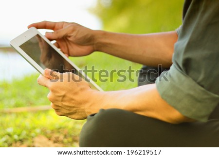 Businessman using digital tablet,hand touching screen on digital tablet