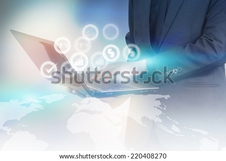 Businessman holding business icons.