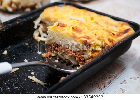 Pie with spaghetti and lamb meat