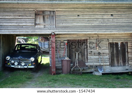 stock photo Old Volvo Amazon by Barn