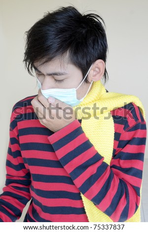 Portrait of a young man wearing a virus protection mask