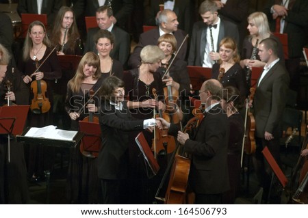DNEPROPETROVSK, UKRAINE - NOVEMBER 25: Members of the Symphonic Orchestra - main conductor Natalia Ponomarchuk perform music by Gustav Mahler on November 25, 2013 in Dnepropetrovsk, Ukraine
