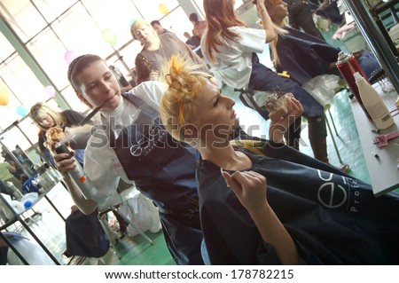 DNEPROPETROVSK, UKRAINE - MARCH 28: Stylist and his model prepar for the Championship on hairdressing, nail aesthetics and make YOUNG TALENTS OF UKRAINE on Mach 28, 2008 in Dnepropetrovsk, Ukraine