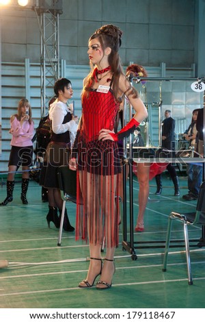 DNEPROPETROVSK, UKRAINE - MARCH 22: Model prepares backstage during the Championship on hairdressing, nail aesthetics and make YOUNG TALENTS OF UKRAINE on Mach 22, 2007 in Dnepropetrovsk, Ukraine