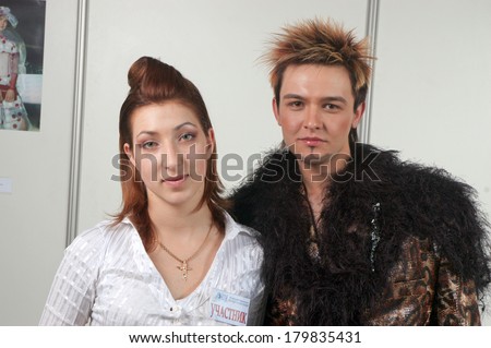 DNEPROPETROVSK, UKRAINE - MARCH 23: Stylist and his model prepar for the Championship on hairdressing, nail aesthetics and make YOUNG TALENTS OF UKRAINE on Mach 23, 2007 in Dnepropetrovsk, Ukraine
