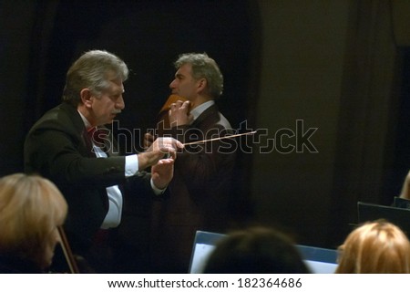 DNEPROPETROVSK, UKRAINE - MARCH 17: FOUR SEASONS Chamber Orchestra - main conductor Sergey Burko perform at the State Russian Drama Theatre on March 17, 2014 in Dnepropetrovsk, Ukraine