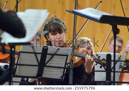 DNIPROPETROVSK, UKRAINE - FEBRUARY 23: Members of the Youth Symphony Orchestra FESTIVAL perform at the Conservatory on February 23, 2015 in Dnipropetrovsk, Ukraine