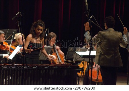 DNIPROPETROVSK, UKRAINE - JUNE 22, 2015: Famous performer Helen Shabelsky (marimba) and  FOUR SEASONS Chamber Orchestra - main conductor Dmitry Logvin perform at the State Russian Drama Theatre
