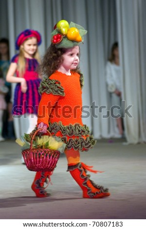 DNEPROPETROVSK, UKRAINE - MARCH 25: unidentified Ukrainian baby shows off his own clothes for unidentified young Ukrainian designer at FASHION TOWN  show on March 25, 2010 in Dnepropetrovsk, Ukraine