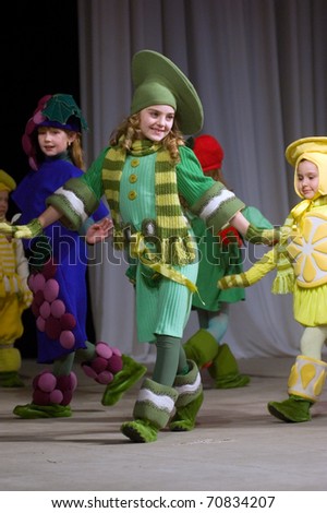 DNEPROPETROVSK, UKRAINE - MARCH 25: unidentified Ukrainian girl shows off his own clothes for unidentified young Ukrainian designer at FASHION TOWN  show on March 25, 2010 in Dnepropetrovsk, Ukraine