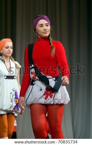 DNEPROPETROVSK, UKRAINE - MARCH 25: Ukrainian girl shows off his own clothes for unidentified young Ukrainian designer at FASHION TOWN  show on March 25, 2010 in Dnepropetrovsk, Ukraine