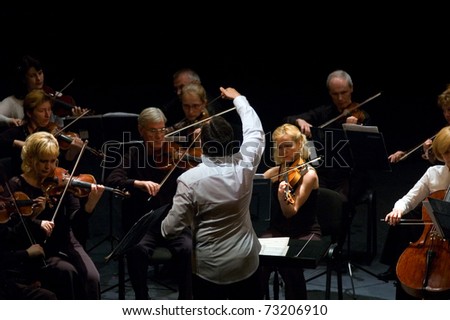 DNEPROPETROVSK, UKRAINE-JUNE 15: \'Four seasons\' Chamber Orchestra - main conductor Dmitry Logvin performed music of Elgar, Bruch, Tchaikovsky on June15,2009 in Dnepropetrovsk, Ukraine