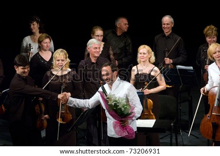 DNEPROPETROVSK, UKRAINE-JUNE 15: \'Four seasons\' Chamber Orchestra - main conductor Dmitry Logvin performed music of Elgar, Bruch, Tchaikovsky on June15,2009 in Dnepropetrovsk, Ukraine