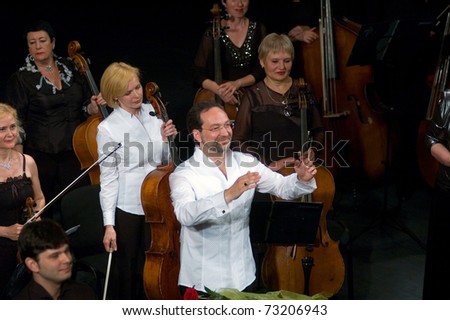 DNEPROPETROVSK, UKRAINE-JUNE 15: 'Four seasons' Chamber Orchestra - main conductor Dmitry Logvin performed music of Elgar, Bruch, Tchaikovsky on June15,2009 in Dnepropetrovsk, Ukraine