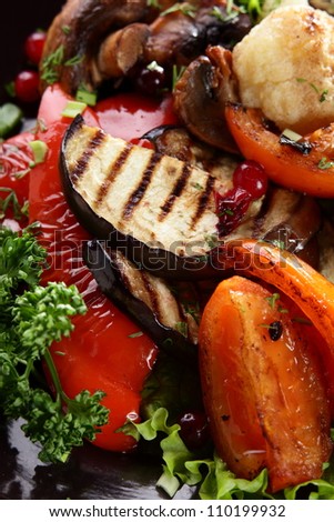 roasted vegetables with mushrooms on black hot pan
