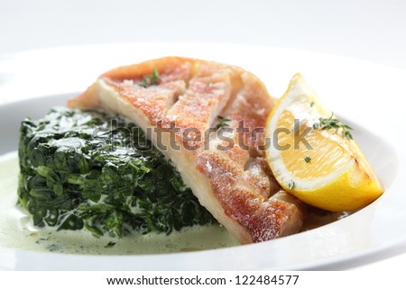 cold and fresh peaces of fish on white dish