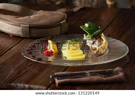hot and tasty peaces of potato on transparent dish