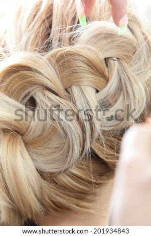 blond girl hair cut in european beauty salon