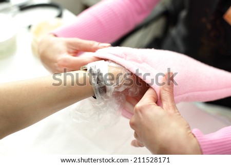 women hands care in beauty salon on white background
