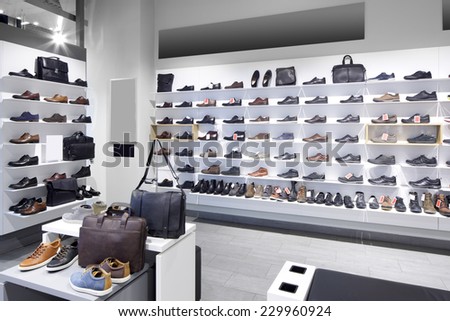 bright and fashionable interior of shoe store in modern mall