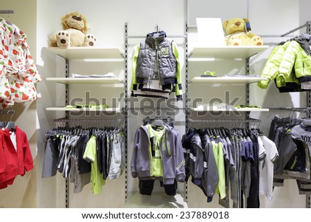 luxury and fashionable brand new interior of kids cloth store