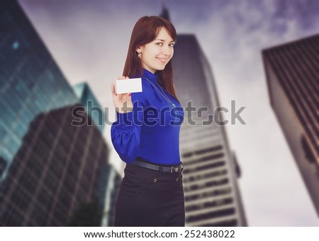 Empty business card in a businesswomen hand