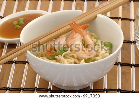 Bowl of delicious oriental noodles with shrimp.