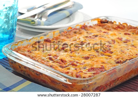 Tasty mexican style casserole with cheese and salsa.