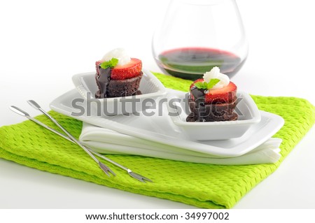 Delicious bite size brownie and strawberry dessert.