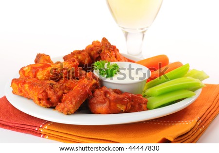 Hot and spicy buffalo chicken wings and crisp vegetables.