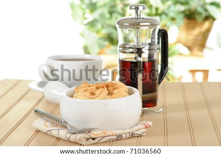 Single serving apple pastry served with coffee.