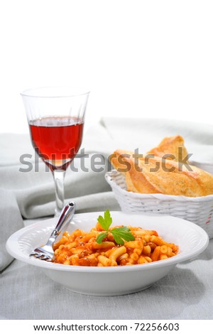 Macaroni with a tomato beef sauce served with crusty bread.
