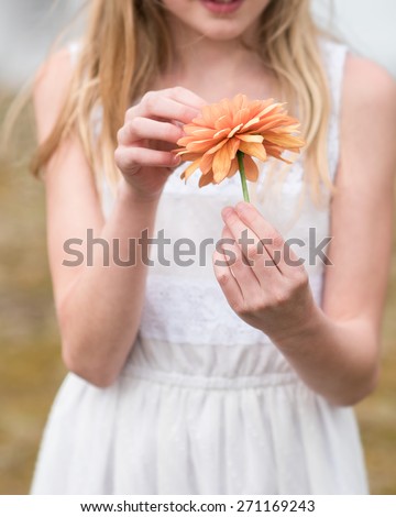 Young girl with flower