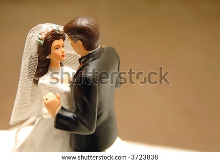 stock photo bride and groom dancing wedding cake topper