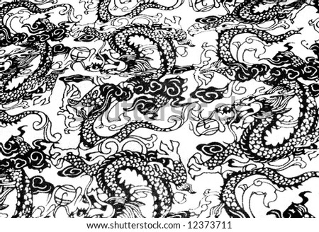 photo of black and white asian dragon stitching on fabric for background texture