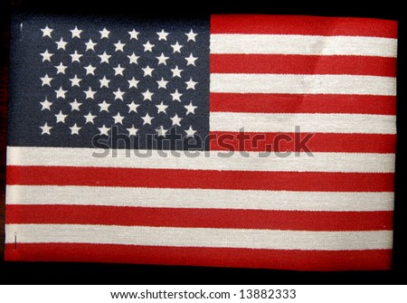 photograph of small american flag on stick