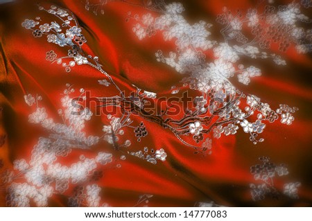 Fashionable asian red silk robe closeup, for background texture--selective focus