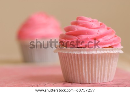 stock photo pink and white simple wedding cupcakes on pink matt