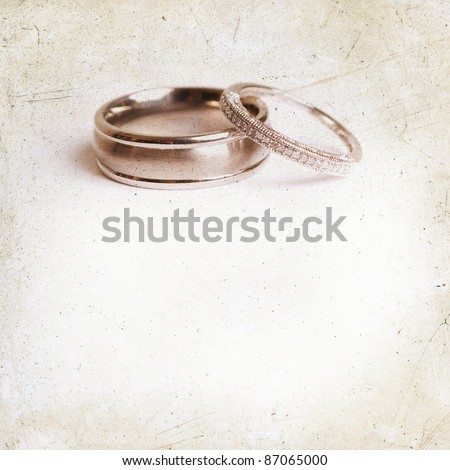 stock photo Vintage Grunge textured wedding background with wedding rings