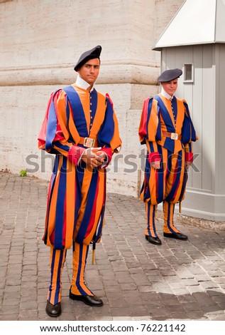 stock-photo-vatican-city-italy-august-two-swiss-guards-dressed-in-uniforms-designed-by-leonardo-da-vinci-76221142.jpg