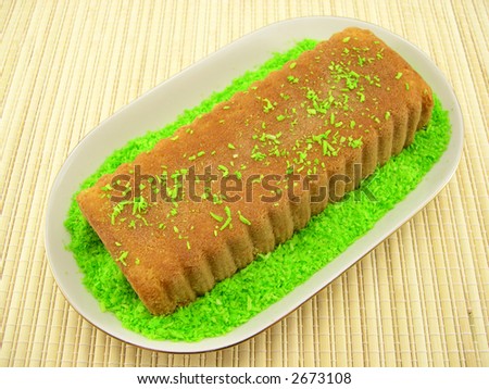 Beautiful fruitcake in a plate on a bamboo napkin