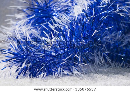 New years blue and white tinsel. Background Christmas theme